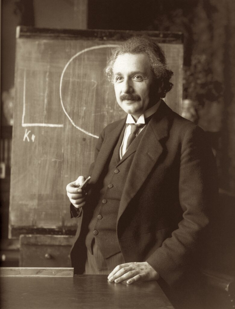 Albert Einstein in front of a blackboard
